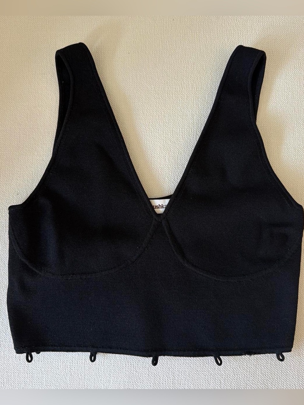 black V-neck cropped eyelet tank top by Nanushka